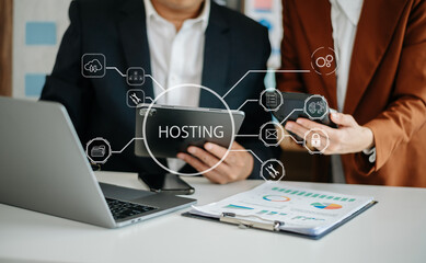 Web hosting concept, business using computer and presses his finger on the virtual screen inscription Hosting on desk, Internet, business, Technology