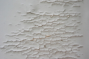 Old leather torn sofa cover. Cracked couch skin texture background.