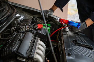 Car care maintenance and service, Hand technician auto mechanic using measuring manifold gauge check refrigerant and filling car air conditioner to fix repairing heat conditioning system.