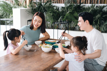 Image of Asian family eating lunch together
