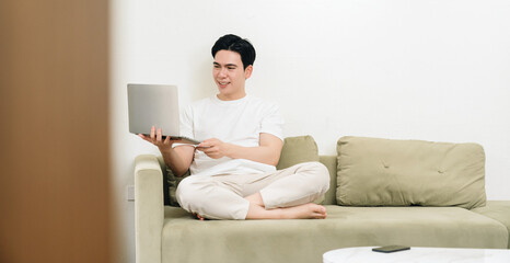 Obraz premium Image of young Asian man at home