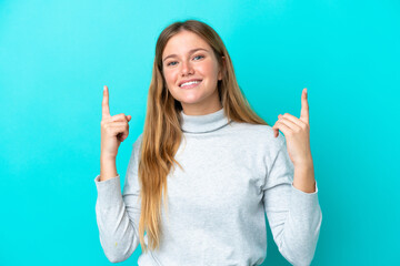 Young blonde woman isolated on blue background pointing up a great idea