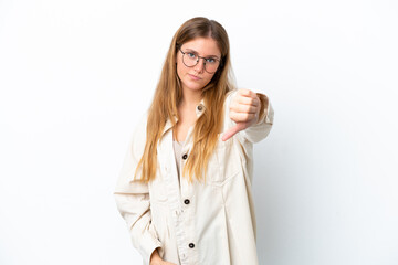 Young blonde woman isolated on white background showing thumb down with negative expression