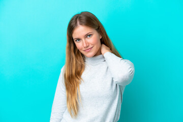 Young blonde woman isolated on blue background laughing