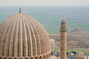 The dome and minaret of the Ulu Cami Mosque in Mardin overlooking the vast plains of Mesapotamia