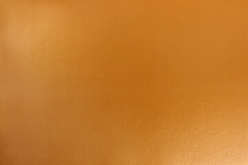 Gold background with cardboard texture and gradient. A graphic resource for designers.