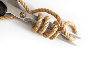 Jute rope wrapped around scissors blades, isolated on white