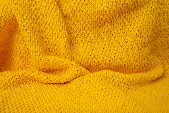 Crochet orange blanket, abstract backdrop
