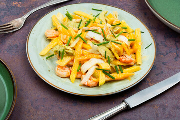 Salad with prawns and fruits.