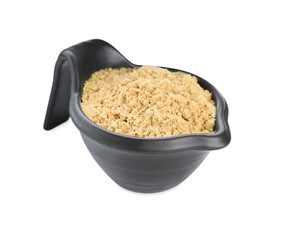 Aromatic mustard powder in gravy boat on white background