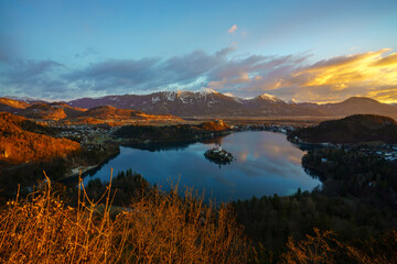Aerial view of Lake Bled and Julian Alps, with Pilgrimage Church of the Assumption of Maria at sunrise, Slovenia