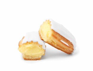 Cut delicious eclair covered with glaze isolated on white