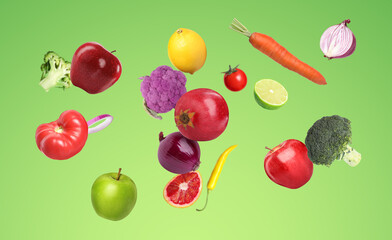 Many fresh vegetables and fruits falling on light green background