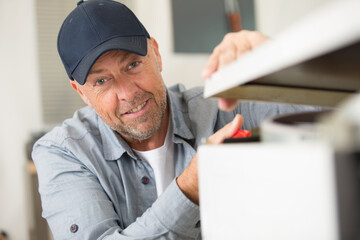 service contractor assembling kitchen furniture