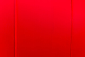 Moldings on a bright red wall. Modern trends in decor and interior design. Close-up.