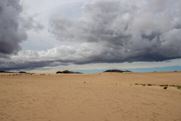 Sand dunes and cloudy sky, Fuerteventura, Spain