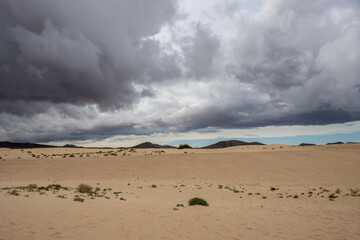 Sand dunes and cloudy sky, Fuerteventura, Spain