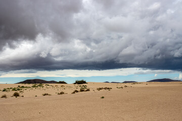 Sand dunes and cloudy sky, Fuerteventura, Spain