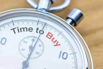 Time to buy assets or invest in long-term value stocks, financial concept : Closeup of a stopwatch...