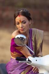 Fototapeta na wymiar Bride. Beautiful young caucasian woman in traditional indian clothing