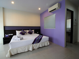 Hotel Room Decorated single bedroom with bed nice colours