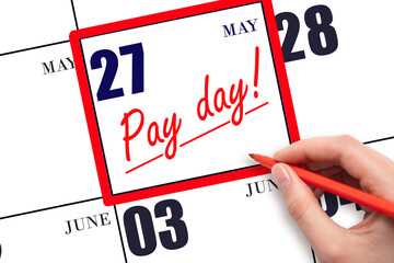 Hand writing text PAY DATE on calendar date May 27 and underline it. Payment due date