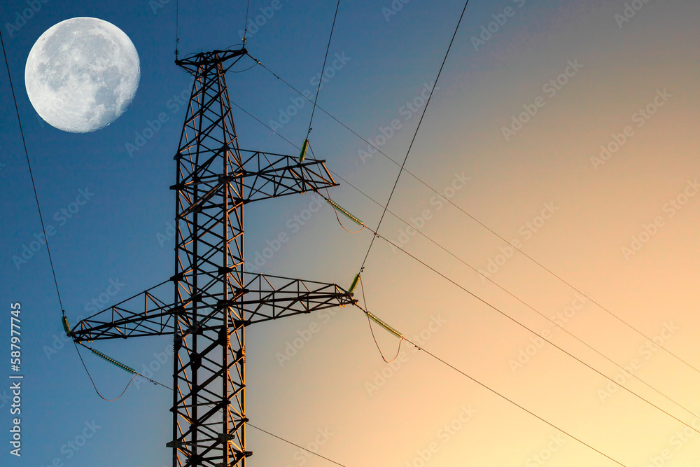 Wall mural power line support with wires for electricity transmission. high voltage grid tower and big moon. en