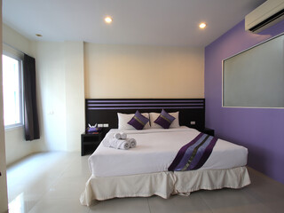 Hotel Room Decorated single bedroom with bed nice colours