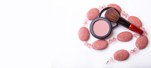 Obraz na płótnie Canvas Pink blush powder and blush brush. Top view, copy space. Makeup concept. banner