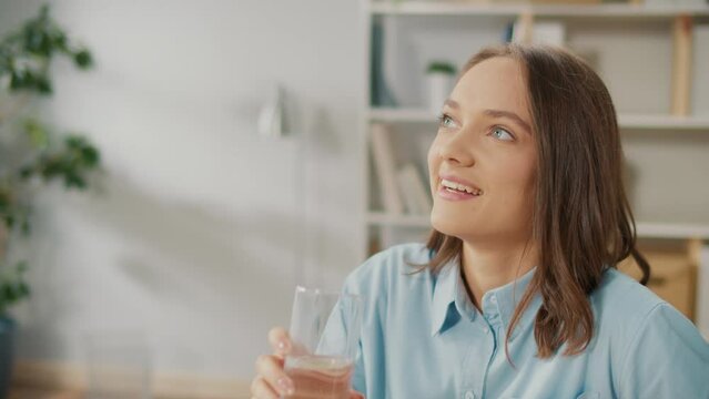 Female Office Worker Drink a Glass of Clean Water During a Break Between Work. Take Break Drink Natural Mineral Water Makes Sip Caring About Health, Prevents Dehydration. Everyday Routine Concept.