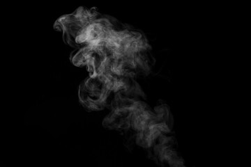 White curling dense smoke steam rising up is isolated on black background to overlay your photos.