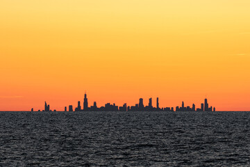 Distant Chicago skyline sunset, taken over Lake Michigan from Indiana, USA, approximately 35 miles away