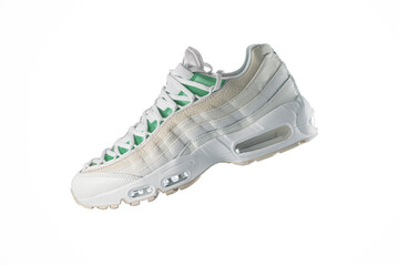 White sneaker with light green accents on a white isolated background, men's fashion, sport shoe, air, sneakers, lifestyle, concept, product photo, levitation concept, street wear, trainers
