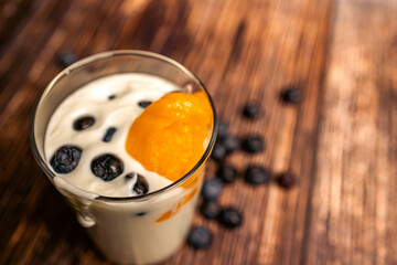 Fresh and Healthy Breakfast with Peach, Blueberries, and Yogurt