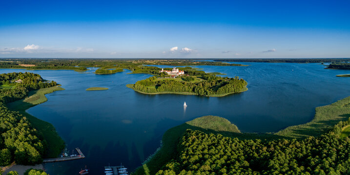 Drone aerial landscape photo - Camaldolese monastery complex and Wigry Lake, national park - summer in Poland