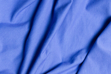 Top view blue knitted cotton fabric with creases