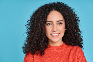 Young adult stylish smiling latin woman, happy pretty curly hispanic female model student with...