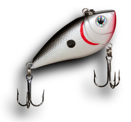 Shadow behind a grey, red and white plastic fishing lure angling toward the surface