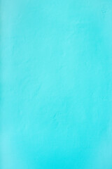 The Vertical teal blue green cement wall texture background.