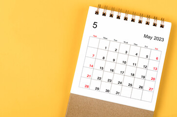 A May 2023 Monthly desk calendar for 2023 year on yellow background.