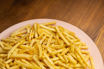 potato straw close-up. potato in a bowl on a wooden table    