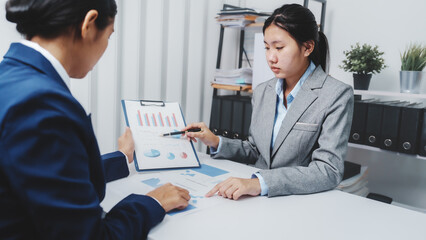Young Asia female leader business woman coaching new smes bookkeeping audit accounting interview with trainer training business job.