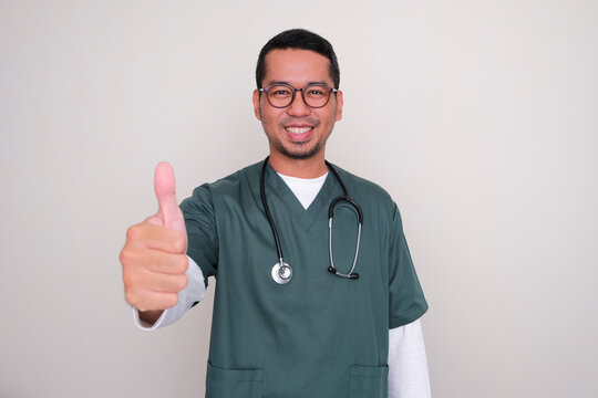 Asian hospital nurse smiling and give thumb up