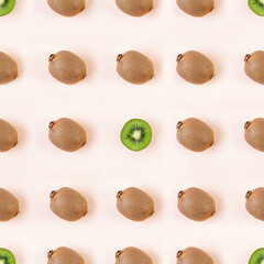 Kiwi fruit on wooden background. Pattern with juicy kiwifruit