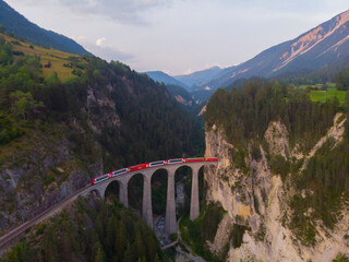 Aerial view of the famous red train on the Landwasser Viaduct, Switzerland.