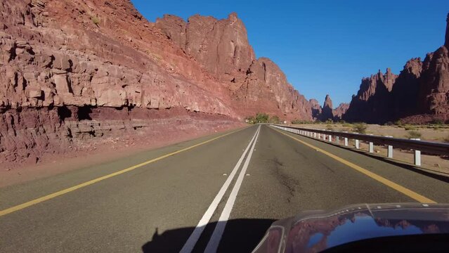 Al Disah, Saudi Arabia: Point of view of a car driving on the road toward the Wadi Al Disah canyon in the Tabuk region in Saudi Arabia.
