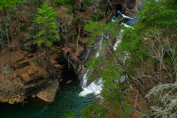 Outlooks around Tallulah Falls are in northeast of Atlanta, Habersham and Rabun County, Georgia. They are a series of six waterfalls cascading through Tallulah Gorge, an ancient 1,000-foot chasm carve - obrazy, fototapety, plakaty