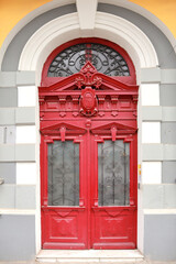 Fototapeta na wymiar Wooden red vintage door in downtown of Odessa, Ukraine