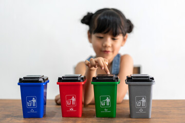 Asian young play empty recycle plastic bottle garbage toy and reduce ecology environment into the...