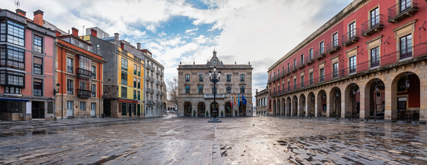 Great panoramic view of the main square of the city of Gijon with its classic buildings and stone arches, Asturias, Spain. © josemiguelsangar